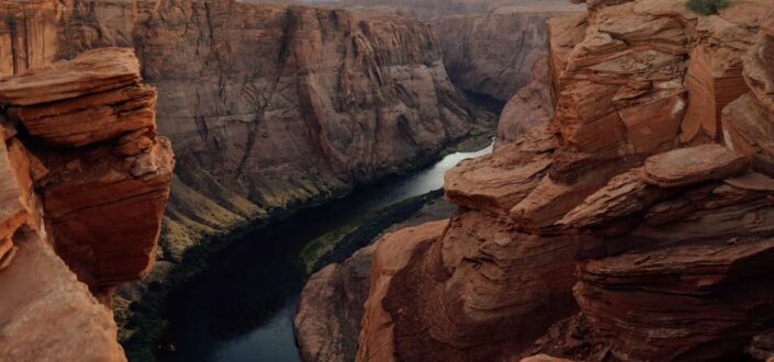 Brown Rock Formation Near Body of Water