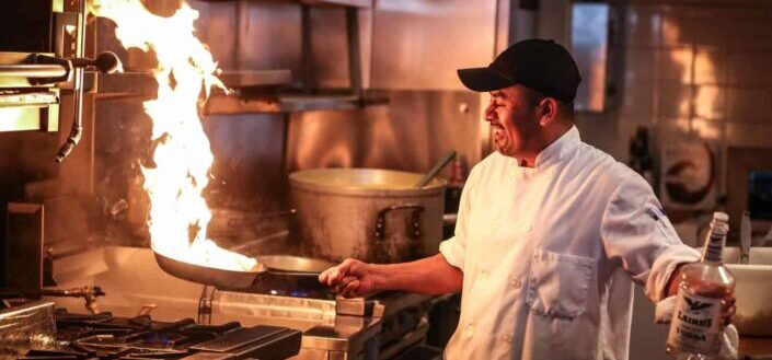 Chef Cooking in a Restaurant Kitchen