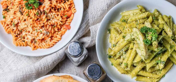 Pasta With Bread Served on the Table