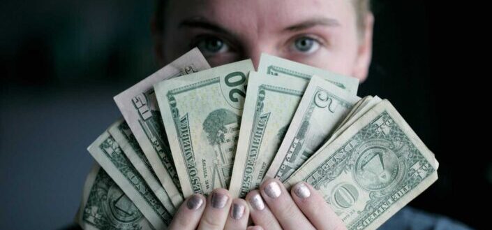 Young Woman Holding Money