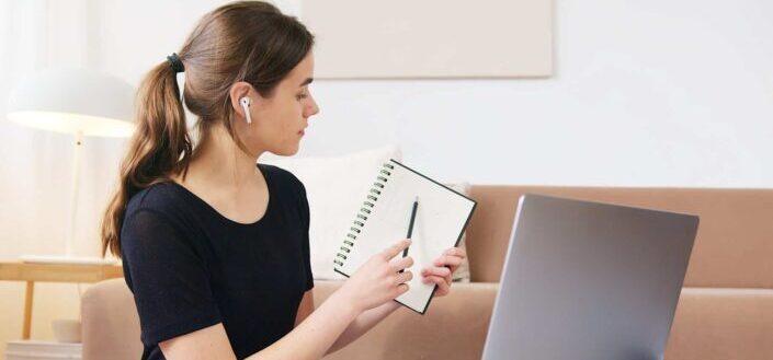 Focused Woman Using Laptop