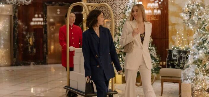 Fashionable Women in Suits Walking Along the Lobby