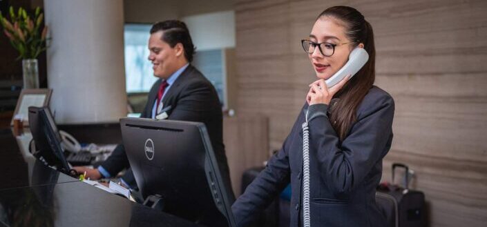 Receptionists Working at the Front Desk Lobby