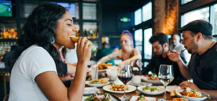  People Enjoying Their Meal in a Restaurant