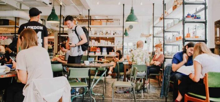 People Studying and Eating at a Cafe